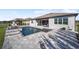 Gorgeous backyard pool with attached spa and grey brick pool deck at 8630 Sw 61St Loop, Ocala, FL 34481