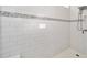 All-white tiled shower with gray accents at 8630 Sw 61St Loop, Ocala, FL 34481