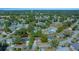 Aerial view of the neighborhood showing the property's location in a community setting with mature trees at 8639 Sw 116Th Lane Rd, Ocala, FL 34481