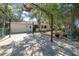 This house has a large stone patio with mature landscaping and an outdoor shelter at 8639 Sw 116Th Lane Rd, Ocala, FL 34481