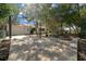 A beautifully landscaped backyard featuring a stone patio and a cozy fire pit area at 8639 Sw 116Th Lane Rd, Ocala, FL 34481
