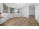 The dining room has wood-look floors and a bright, large window at 8639 Sw 116Th Lane Rd, Ocala, FL 34481