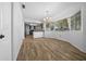 Dining room with wood-look tile, a chandelier, and a large window at 8639 Sw 116Th Lane Rd, Ocala, FL 34481