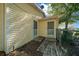 Side view of the house featuring two exterior doors and a fenced yard at 8639 Sw 116Th Lane Rd, Ocala, FL 34481