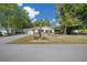 Charming single-story home with well-maintained landscaping and inviting curb appeal on a sunny day at 8639 Sw 116Th Lane Rd, Ocala, FL 34481