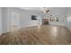 Living room featuring wood-look floors and a brick fireplace at 8639 Sw 116Th Lane Rd, Ocala, FL 34481