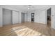 Spacious main bedroom with two closets, wood-look tile floor, ceiling fan and ensuite bathroom at 8639 Sw 116Th Lane Rd, Ocala, FL 34481