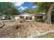 Close-up of a home's porch with a metal security door, offering a glimpse of the interior at 8639 Sw 116Th Lane Rd, Ocala, FL 34481