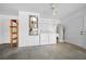 Bright utility room with washer, dryer, water heater, and shelving for ample storage at 8639 Sw 116Th Lane Rd, Ocala, FL 34481