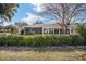 Rear exterior view of the home featuring a screened-in porch and full windowed sunroom at 8707 Sw 95Th Ln # G, Ocala, FL 34481