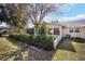 Charming backyard featuring a screened-in porch and full windowed sunroom at 8707 Sw 95Th Ln # G, Ocala, FL 34481