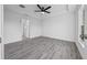 Bright bedroom with ceiling fan and grey vinyl flooring at 9731 Bahia Rd, Ocala, FL 34472