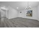 Bright dining room with gray vinyl flooring and large window at 9731 Bahia Rd, Ocala, FL 34472