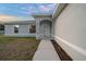 Modern front entrance with walkway leading to the front door at 9731 Bahia Rd, Ocala, FL 34472