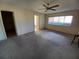 Spacious carpeted bedroom with an ensuite bathroom at 9761 Sw 90Th St, Ocala, FL 34481