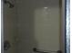 Bathroom shower stall with handrails and a shower head and light at 10015 Sw 90Th Ct, Ocala, FL 34481