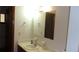 Bathroom vanity featuring a sink, large mirror, and updated lighting at 10015 Sw 90Th Ct, Ocala, FL 34481