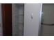 View of the bathroom featuring a standing shower with wire shelving at 10015 Sw 90Th Ct, Ocala, FL 34481