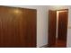 Bedroom closet and door with wood trim and walls painted white at 10015 Sw 90Th Ct, Ocala, FL 34481