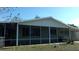Charming home featuring a large, screened lanai for outdoor enjoyment at 10015 Sw 90Th Ct, Ocala, FL 34481