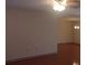 Cozy living room offering hardwood floors and a neutral color palette at 10015 Sw 90Th Ct, Ocala, FL 34481