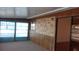 This is a sunroom with carpet floors, wallpaper, and multiple windows at 10015 Sw 90Th Ct, Ocala, FL 34481