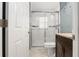 Bathroom featuring a glass-enclosed shower with modern fixtures and beautiful marble tiling at 10473 Se 127Th Pl, Belleview, FL 34420