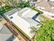 Aerial perspective of the home showcasing a metal roof and a private, fenced backyard at 10900 Se Timucuan Rd, Summerfield, FL 34491