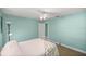 A serene bedroom with calming paint, plush carpet, and a doorway to the ensuite bathroom at 10900 Se Timucuan Rd, Summerfield, FL 34491