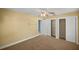Spacious bedroom with closets for ample storage and a convenient attached bathroom at 10900 Se Timucuan Rd, Summerfield, FL 34491