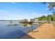Waterfront view from a private dock and pier, providing serene lake access and scenic beauty at 10900 Se Timucuan Rd, Summerfield, FL 34491
