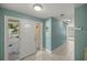 Bright entryway with tiled flooring, a decorative front door, and fresh, inviting paint color at 10900 Se Timucuan Rd, Summerfield, FL 34491