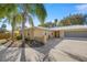 Well-maintained one-story home with a landscaped front yard, brick accents, and a convenient attached garage at 10900 Se Timucuan Rd, Summerfield, FL 34491
