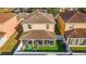 Overhead view of the property with backyard, showcasing the outdoor space featuring a screened patio at 12312 Ne 48Th Loop, Oxford, FL 34484