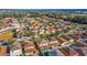Aerial view of a residential community featuring well-kept homes, green spaces, and convenient access to nearby amenities at 12312 Ne 48Th Loop, Oxford, FL 34484