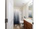 Well-lit bathroom features a shower-tub combo, vanity with storage, and essential fixtures for comfort at 12312 Ne 48Th Loop, Oxford, FL 34484