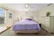 This comfortable bedroom features soft carpet, light walls, and natural light from a window at 12312 Ne 48Th Loop, Oxford, FL 34484