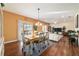 The dining room flows into the living room and features sliding glass doors to the outside at 12312 Ne 48Th Loop, Oxford, FL 34484