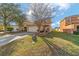 Charming two-story home with a two car garage, beautiful landscaping, and a walkway to the front door at 12312 Ne 48Th Loop, Oxford, FL 34484