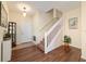 Bright foyer welcomes you with hardwood floors and a staircase leading to the upper level at 12312 Ne 48Th Loop, Oxford, FL 34484