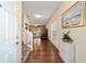 Inviting foyer with hardwood floors and an open view into the living area at 12312 Ne 48Th Loop, Oxford, FL 34484