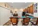 Eat in kitchen featuring a bar area with stools and a stainless steel microwave at 12312 Ne 48Th Loop, Oxford, FL 34484