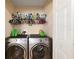 Convenient laundry room with side by side washer and dryer at 12312 Ne 48Th Loop, Oxford, FL 34484