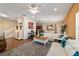 Open-concept living area with wood floors, stairs, modern décor, and ample natural light at 12312 Ne 48Th Loop, Oxford, FL 34484