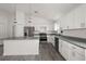 A bright kitchen featuring modern appliances, white cabinets, granite counters and pendant lighting at 13743 Sw 113 Ln, Dunnellon, FL 34432