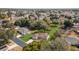 Wide aerial view shows neighborhood homes with mature trees and landscaping at 13779 Sw 115Th Cir, Dunnellon, FL 34432