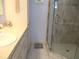 Bathroom featuring a vanity with sink, linen cabinet and glass-enclosed shower at 13779 Sw 115Th Cir, Dunnellon, FL 34432