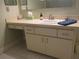 Bathroom showcasing a vanity with sink and storage space at 13779 Sw 115Th Cir, Dunnellon, FL 34432