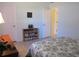 Well-lit bedroom featuring a dresser, storage shelves, and doorways leading to other rooms at 13779 Sw 115Th Cir, Dunnellon, FL 34432
