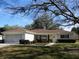 Attractive single-story home with attached garage, well-kept landscaping, and inviting entrance at 13779 Sw 115Th Cir, Dunnellon, FL 34432